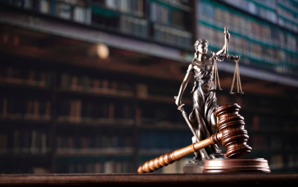 Law theme. Themis statue and judge gavel in the law faculty libr